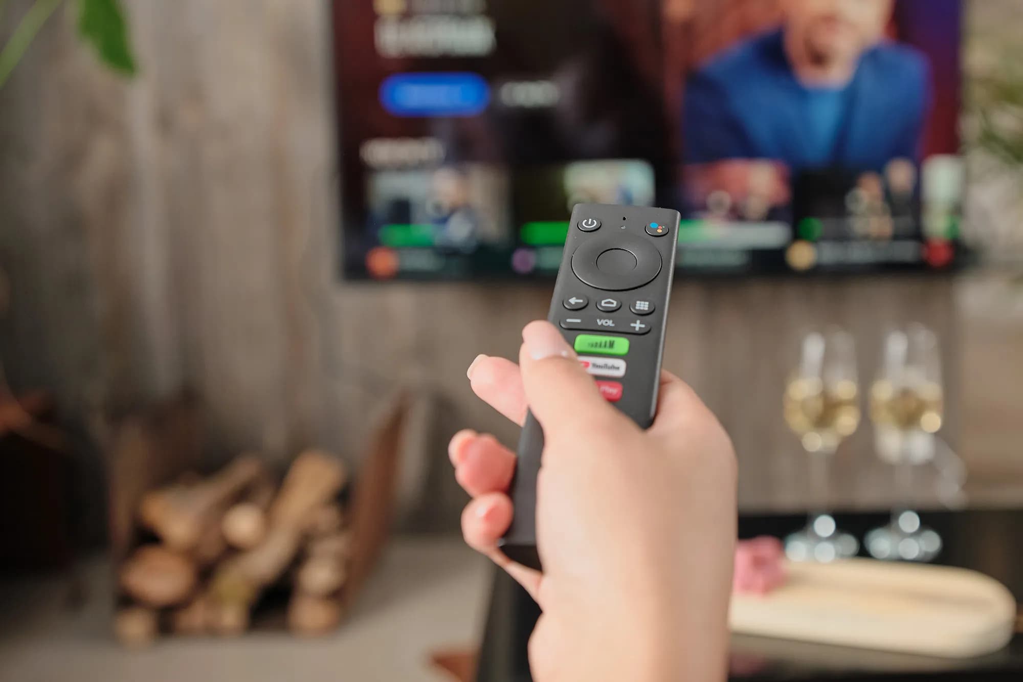 A person holding a TADAAM remote
